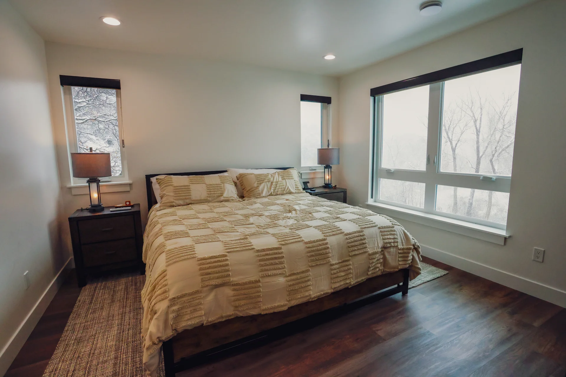 Primary bedroom with natural light and mountain views